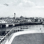 千代田小学校より見たる両国橋及び本所国技館の遠望<br>View of Ryōgokubashi Bridge and the Sumo Stadium in Honjo from the rooftop of Chiyoda Primary School<br>Source: Postcard, 1930